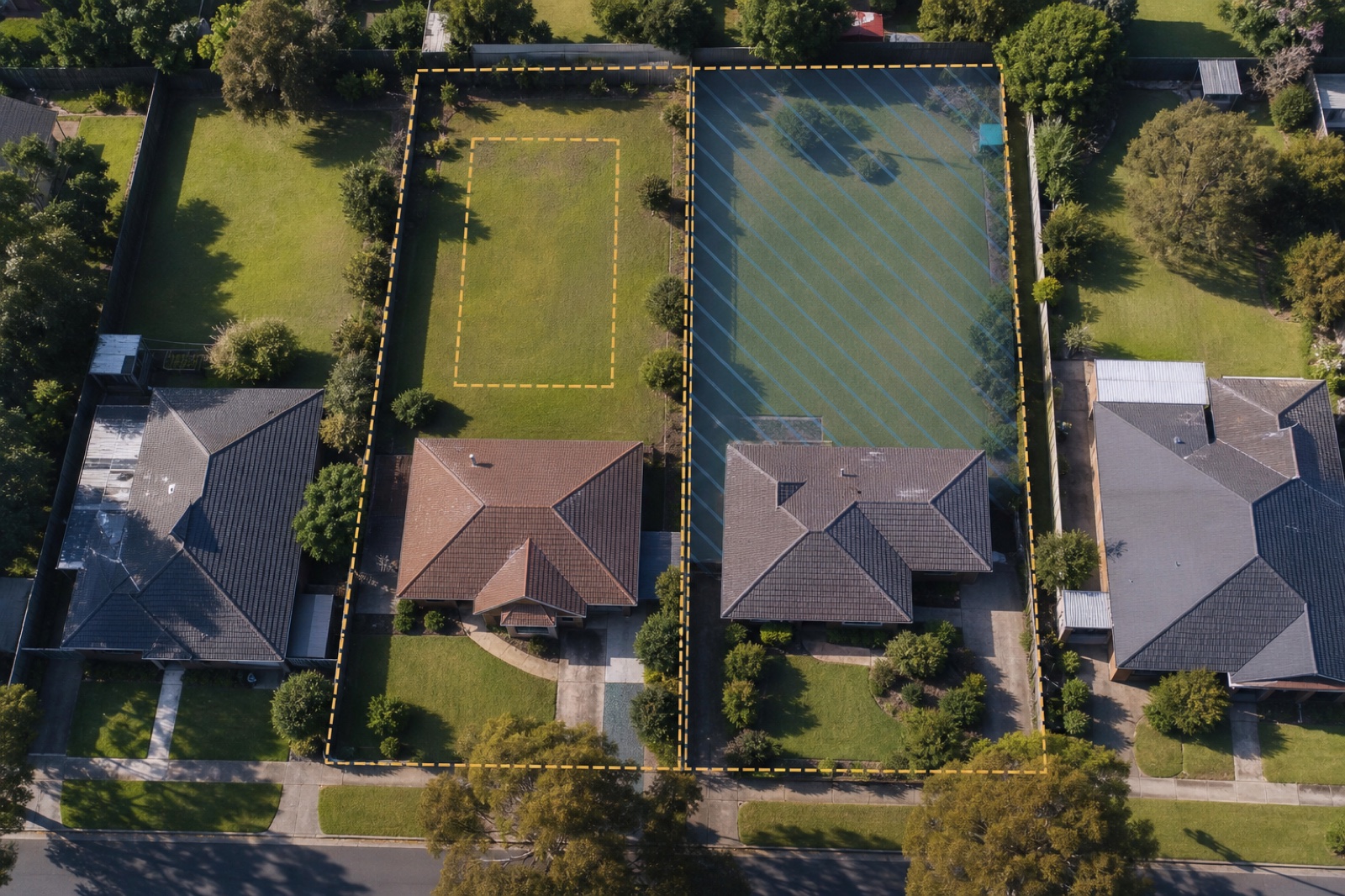 Schematic site plan: a subdividable rear yard against one inside a flood overlay